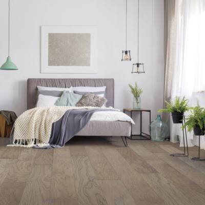 bedroom with natural-toned flooring